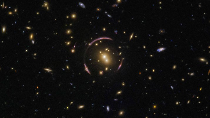 A Light Distorting “Einstein Ring” Discovered By The Hubble Telescope In Distant Galaxy Cluster